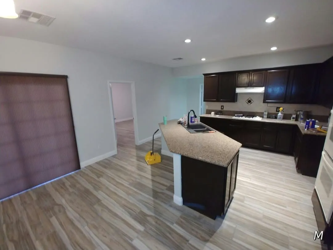 Open kitchen, plank tile — kitchen by Happy Homes Remodeling, Henderson, NV